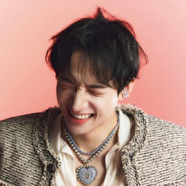 Kim Hongjoong dressed in a white hoodie.